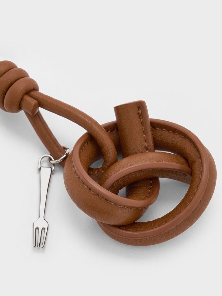 Charles & Keith Pretzel Keychain Charm with Fork (Category: Charms) located in Manila. Submitted by morningkofi (Listing ID 1462372838, Image 1). Description: brand new & never used! just stored in the box :) out of stock already on the website & in stores SRP: 1,200.