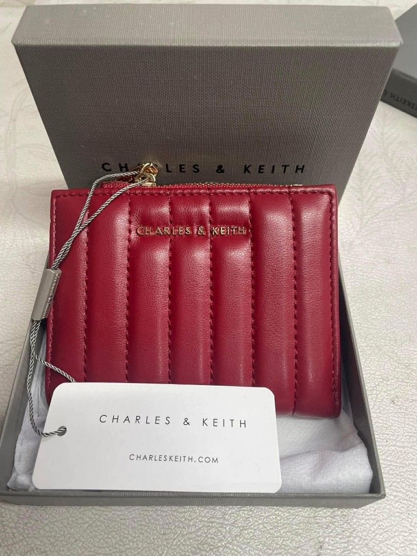 Charles & Keith Quilted Zip Around Wallet (Category: Wallets & Card holders) located in Santo Domingo. Submitted by krizzies_korner (Listing ID 1462379778, Image 3). Description: - Cute quilted wallet from Charles & Keith - Available in black, white, or red - Secure zip-around closure - Ample space for cards and cash - Ideal for everyday use or travel - Comes with original box.