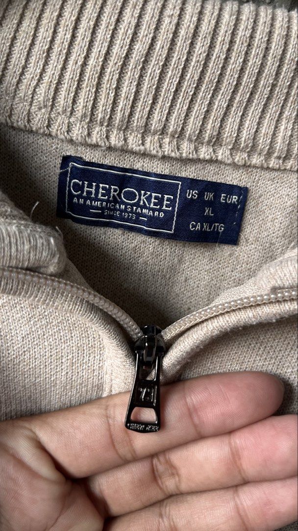 Cherokee Beige 1/4 Zip Pullover Sweater XL (Category: Coats, Jackets and Outerwear) located in Cabuyao City. Submitted by bulandos (Listing ID 1462407707, Image 2). Description: - Cherokee 1/4 zip pullover sweater - Color: Beige - Size: XL - Small embroidered logo on chest - Ribbed cuffs and hem - Versatile for layering or standalone wear.