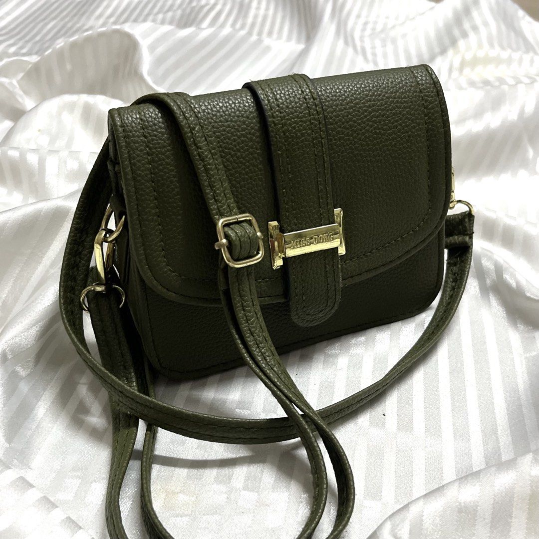 Chic Olive Mini Flap Bag/Cross Body (Category: Purses & Pouches) located in Manila. Submitted by ave.archives (Listing ID 1462357236, Image 1). Description: Details: • Flap closure with secure snap/magnetic lock • Adjustable and detachable shoulder/crossbody strap • Premium gold-toned hardware details • Perfect for: Casual day-outs, errands, brunch dates, or minimalist capsule wardrobes..