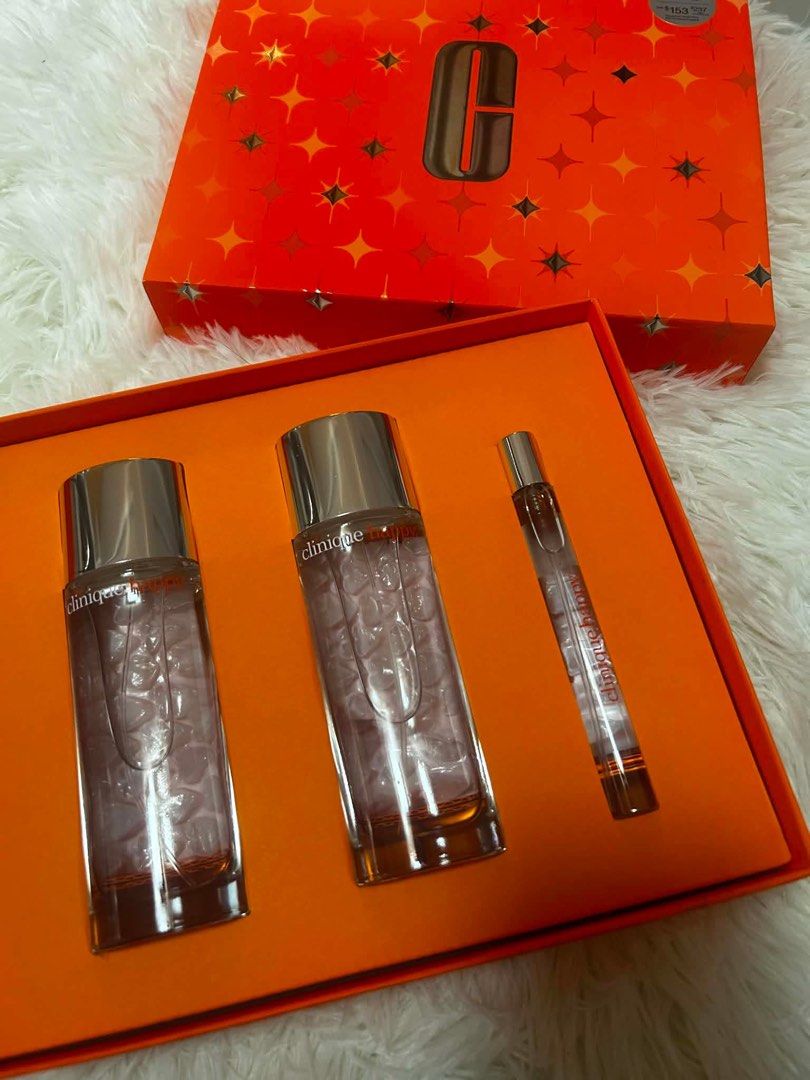 Clinique Happy Perfume Gift Set (Category: Fragrance & Deodorants) located in Quezon City. Submitted by ronalynmomoa22 (Listing ID 1462364049, Image 1). Description: - Clinique Happy fragrance gift set - Includes two full-size bottles and one rollerball - Presented in an orange box with star details - Ideal for gifting or personal enjoyment - Original Suggested Retail Price: $202 USD / $237 CAD.