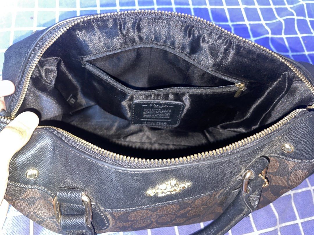 Coach Bag (Category: Luxury Bags & Wallets) located in Bulacan. Submitted by keytxcx (Listing ID 1462352319, Image 3). Description: Classic Coach monogram satchel - Slightly used! - Color: Brown and Black - Features top handles - Detachable shoulder strap included - Interior: 1 zip pocket, slip pockets - Gold hardware details - Ideal everyday bag - Used but not abused - Bought at Ukay ukay! - No box & dustbag! - See the condition in the pics - Pr