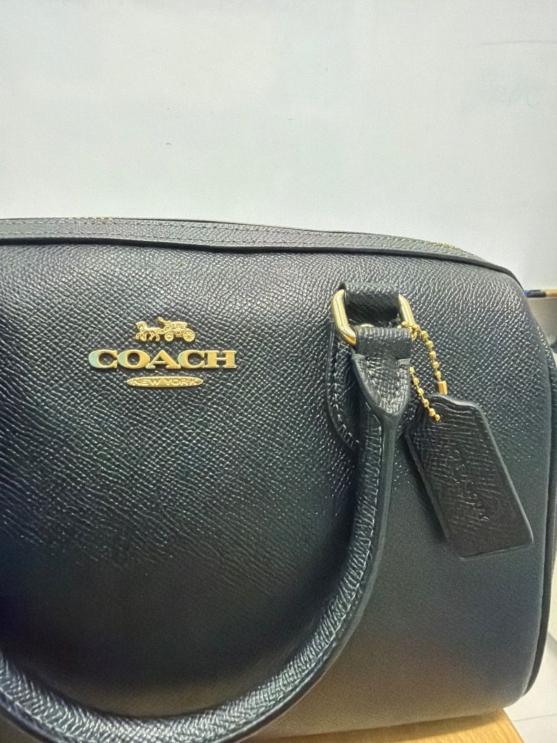 Coach Black Leather Satchel Bag (Category: Luxury Bags & Wallets) located in Valenzuela. Submitted by nikay07 (Listing ID 1462346582, Image 2). Description: - Classic black Coach satchel bag - Pebbled leather exterior - Gold hardware accents - Features top handles - Includes detachable Coach tag - Ideal for everyday use - Clean interior, well-maintained - Ready for its new owner.