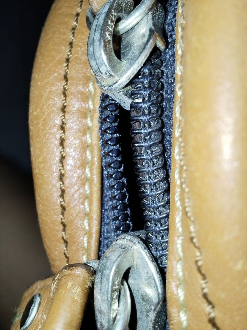 Coach Brown Leather Crossbody Bag (Category: Cross-body Bags) located in Manila. Submitted by bagelyascollection (Listing ID 1462366470, Image 3). Description: - Authentic Coach brown leather crossbody bag - Soft leather with some signs of wear, adding character - Main zippered compartment for secure storage - Additional front zippered pocket for quick access - Interior includes a zippered pocket and a slip pocket for organization - All zippers a