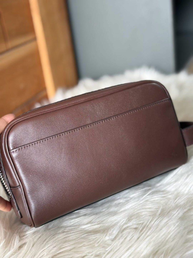 Coach Brown Leather Pouch/Clutch (Category: Purses & Pouches) located in Manila. Submitted by clairetot (Listing ID 1462370344, Image 3). Description: Original clutch Brown leather pouch from Coach. Has a zip closure and a side handle. Great for organizing essentials or as a small clutch. Clean interior. Minimal signs of wear..