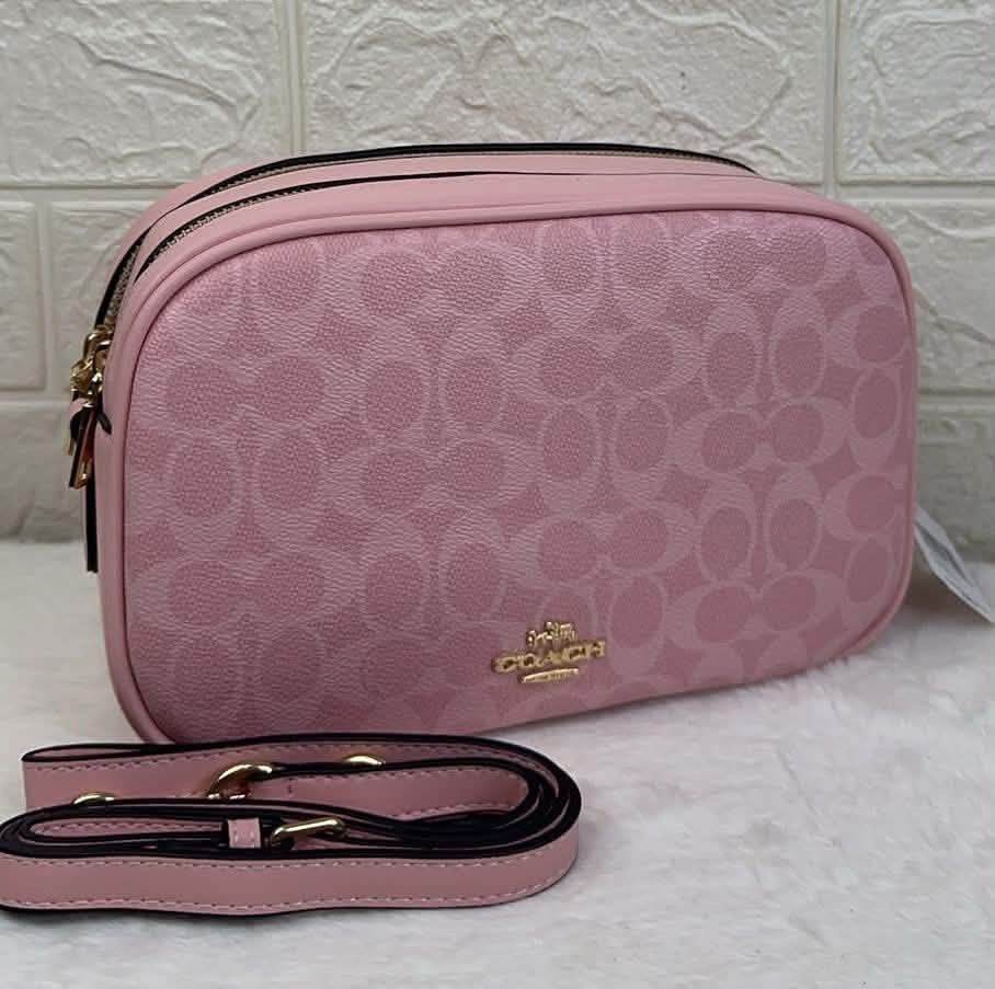 Coach crossbody bag (Category: Cross-body Bags) located in Quezon City. Submitted by stuffs.hellyy (Listing ID 1462430621, Image 3). Description: 25x15cm Made in Vietnam 🇻🇳 double-zip design and elegant gold-tone hardware .