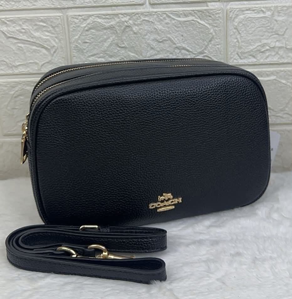 Coach crossbody bag (Category: Cross-body Bags) located in Quezon City. Submitted by stuffs.hellyy (Listing ID 1462430621, Image 1). Description: 25x15cm Made in Vietnam 🇻🇳 double-zip design and elegant gold-tone hardware .