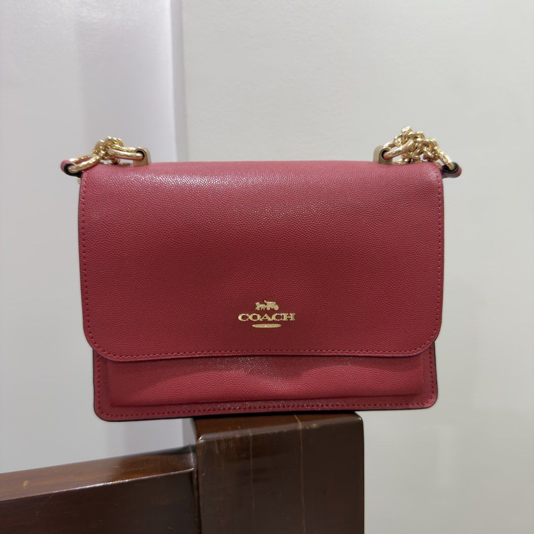 Coach Klare Crossbody Bag (Category: Luxury Bags & Wallets) located in Quezon City. Submitted by miumuse_ (Listing ID 1462320082, Image 1). Description: - Coach pebbled leather shoulder bag - Lovely berry shade - Gold chain strap - Flap closure with magnetic snap - Clean interior .