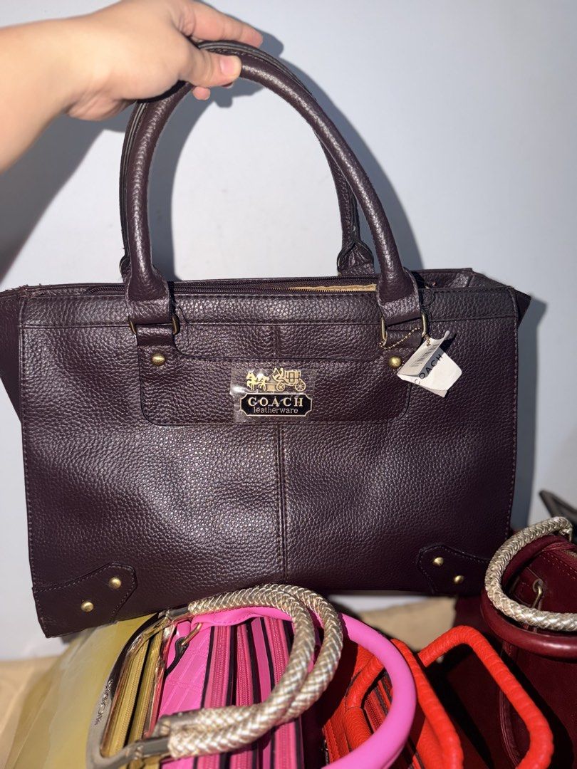 Coach Leatherware Dark Brown Pebbled Leather Tote Bag (Category: Luxury Bags & Wallets) located in Manila. Submitted by lhynbagscollection (Listing ID 1462415990, Image 1). Description: - Brand: Coach Leatherware - Color: Dark Brown - Material: Pebbled Leather - Style: Classic Tote Bag - Features: Top handles, gold-tone hardware, zipper closure - Condition: New with original tag - Interior: Spacious, ideal for essentials - Use: Great for everyday