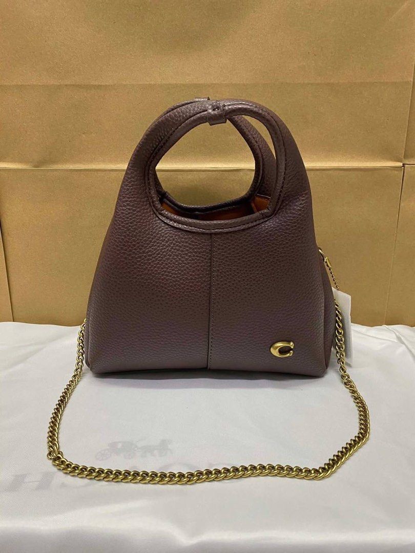 Coach Mini Lana (Category: Luxury Bags & Wallets) located in Manila. Submitted by cher.ish.ed (Listing ID 1462399238, Image 3). Description: - Coach Mini Lana - Comes with a chain strap - Available colors: brown suede, black, dark purple, white, grey - Gold hardware - Versatile for everyday use or nights out.