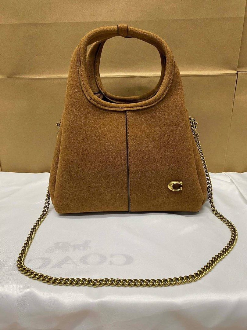 Coach Mini Lana (Category: Luxury Bags & Wallets) located in Manila. Submitted by cher.ish.ed (Listing ID 1462399238, Image 1). Description: - Coach Mini Lana - Comes with a chain strap - Available colors: brown suede, black, dark purple, white, grey - Gold hardware - Versatile for everyday use or nights out.
