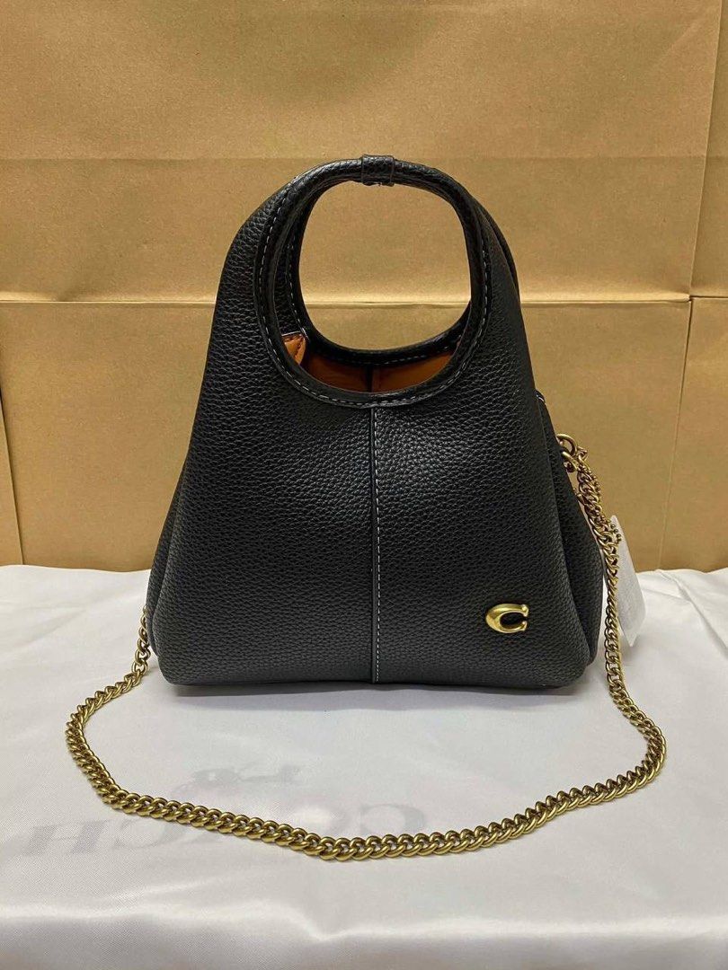 Coach Mini Lana (Category: Luxury Bags & Wallets) located in Manila. Submitted by cher.ish.ed (Listing ID 1462399238, Image 2). Description: - Coach Mini Lana - Comes with a chain strap - Available colors: brown suede, black, dark purple, white, grey - Gold hardware - Versatile for everyday use or nights out.