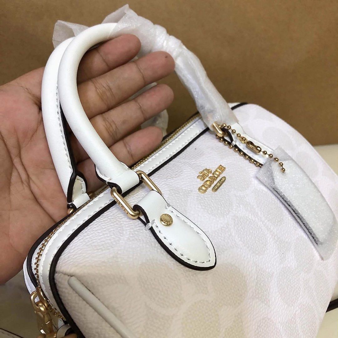 Coach Monogram Mini Dome Satchel Bag White (Category: Voice Recorders) located in Angeles City. Submitted by migs_font29 (Listing ID 1462369859, Image 2). Description: - Authentic Coach mini dome satchel - Signature Coach monogram print - Gold hardware details - Top handles - Detachable crossbody strap - Secure zipper closure - Interior fabric lining with Coach leather patch - Comes with original Coach dust bag.