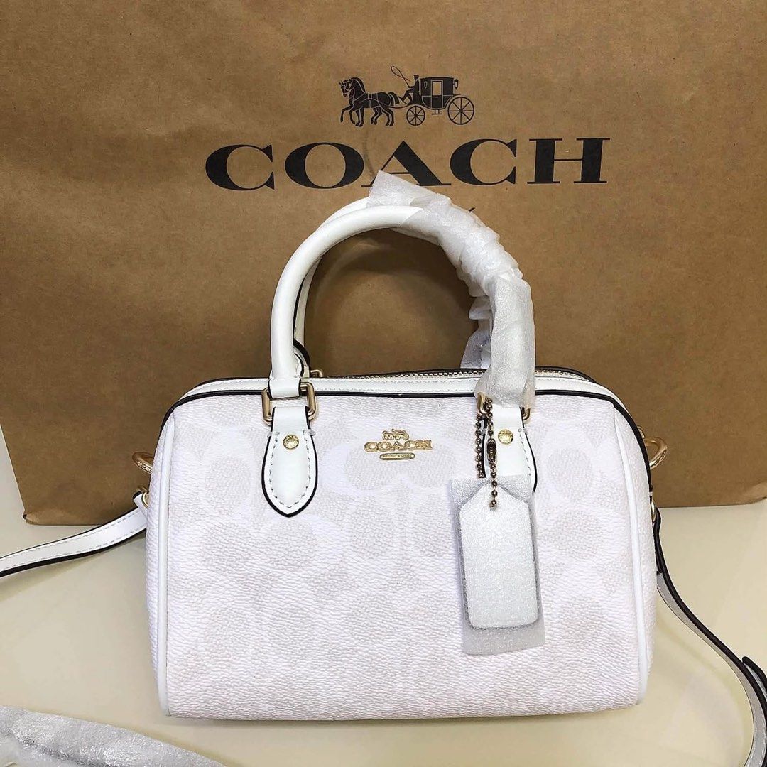 Coach Monogram Mini Dome Satchel Bag White (Category: Voice Recorders) located in Angeles City. Submitted by migs_font29 (Listing ID 1462369859, Image 1). Description: - Authentic Coach mini dome satchel - Signature Coach monogram print - Gold hardware details - Top handles - Detachable crossbody strap - Secure zipper closure - Interior fabric lining with Coach leather patch - Comes with original Coach dust bag.