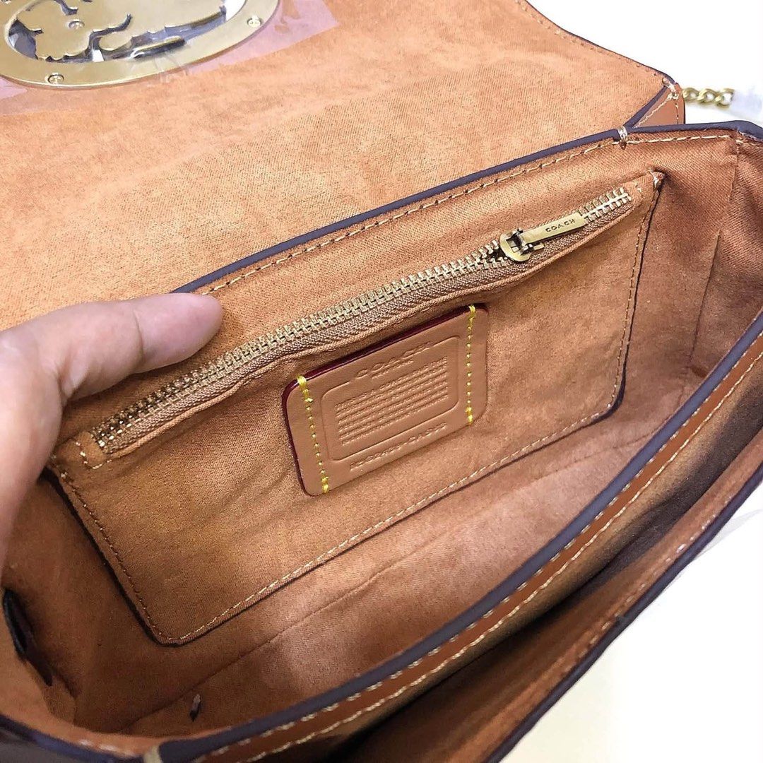 Coach Signature Canvas & Leather Shoulder Bag (Category: Voice Recorders) located in Angeles City. Submitted by migs_font29 (Listing ID 1462369938, Image 2). Description: - Authentic Coach shoulder bag - Signature print with tan leather trim - Iconic horse and carriage emblem on front - Interior zippered pocket - Coach creed patch - Made in Cambodia - Comes with original dust bag.