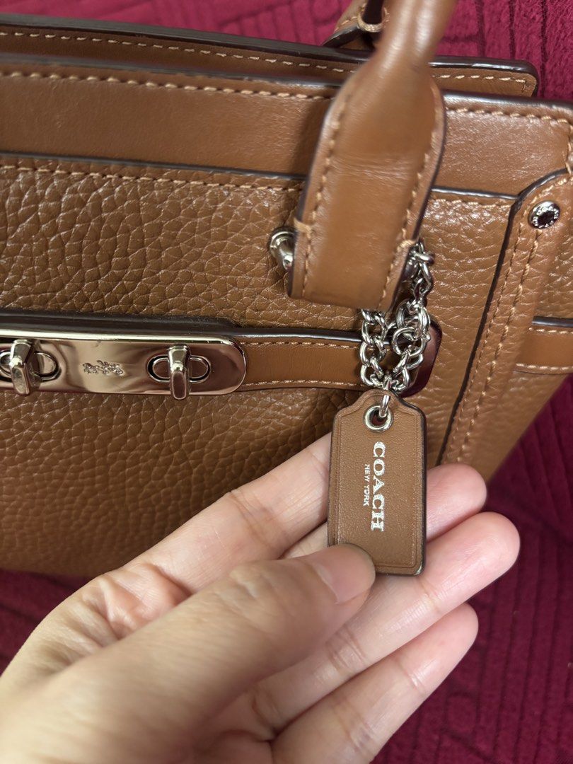 Coach Swagger (Category: Luxury Bags & Wallets) located in Batangas. Submitted by missraee (Listing ID 1462319879, Image 3). Description: - super nice coach swagger in small size - with sling in excellent condition flaw: missing 1 silver hangtag.