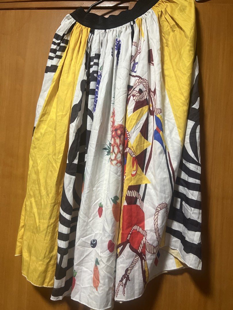 Colorful Fruit and Patterned Midi Skirt (Category: Skirts) located in Pasig City. Submitted by zebteashoppe01 (Listing ID 1462364206, Image 2). Description: - Fun and vibrant midi skirt - Features a mix of fruit prints (strawberries, oranges, pineapples) - Bold black and white stripes - Bright yellow panels - Comfortable elastic waistband - Ideal for creating a statement look Pair with shirt 09096535540 mode of payment gcash same number Pasig Jnt
