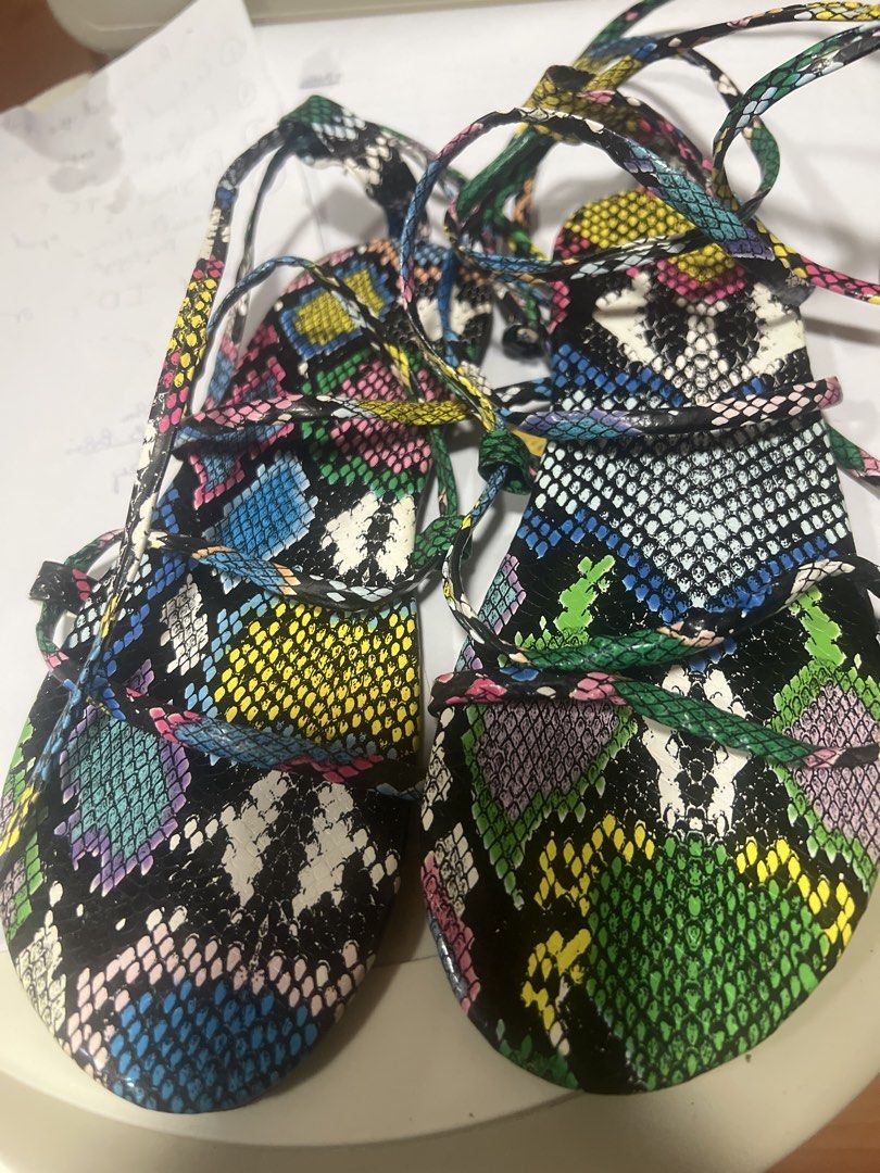 Colorful Snake Print Lace-Up Flat Sandals (Category: Flats & Sandals) located in Pasig City. Submitted by zebteashoppe01 (Listing ID 1462360149, Image 2). Description: - Fun and vibrant snake print design - Lace-up style, can be tied up the leg - Bright, eye-catching colors - Perfect for summer outfits - Sole indicates size 39 - Adds a pop of color to any look 09096535540 same gcash number mop Pasig .