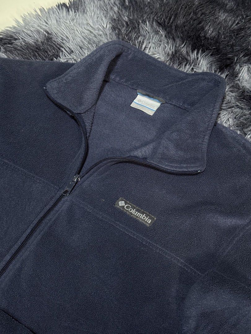 Columbia Fleece Jacket Navy Blue Full Zip (Category: Coats, Jackets and Outerwear) located in Bulacan. Submitted by luck_finds (Listing ID 1462273394, Image 2). Description: - Navy blue Columbia fleece jacket - Full zip closure - Two side pockets - Drawstring hem - Comfortable and warm material - Perfect for layering or standalone wear.