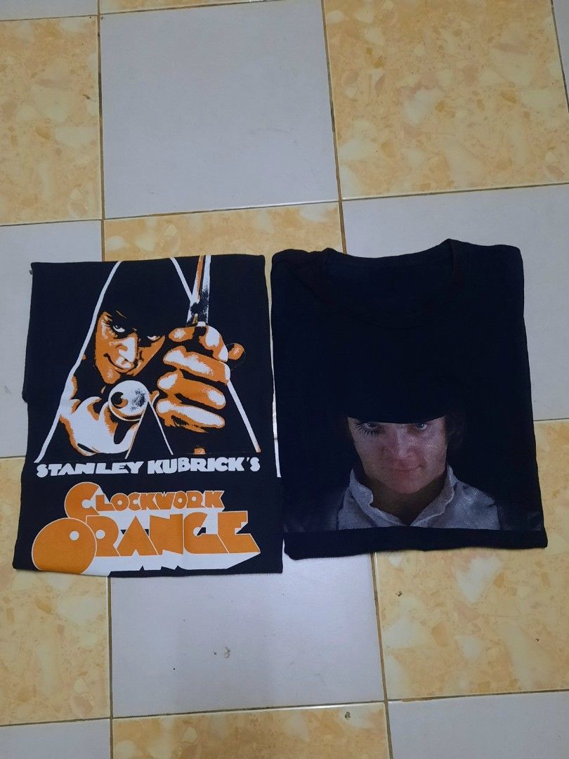 Combo Clockwork Orange (Category: Tshirts & Polo Shirts) located in Seri Kembangan. Submitted by mattrenton_store (Listing ID 1462406500, Image 1). Description: - Iconic Clockwork Orange 'Droog' poster art on the front - Close-up of Alex DeLarge on the back - Black t-shirt - Tagged M/M, fits like a true medium - 100% Cotton - Made in Honduras - Great for fans of the cult classic film - condition good - can see a foto for comform - dfod.