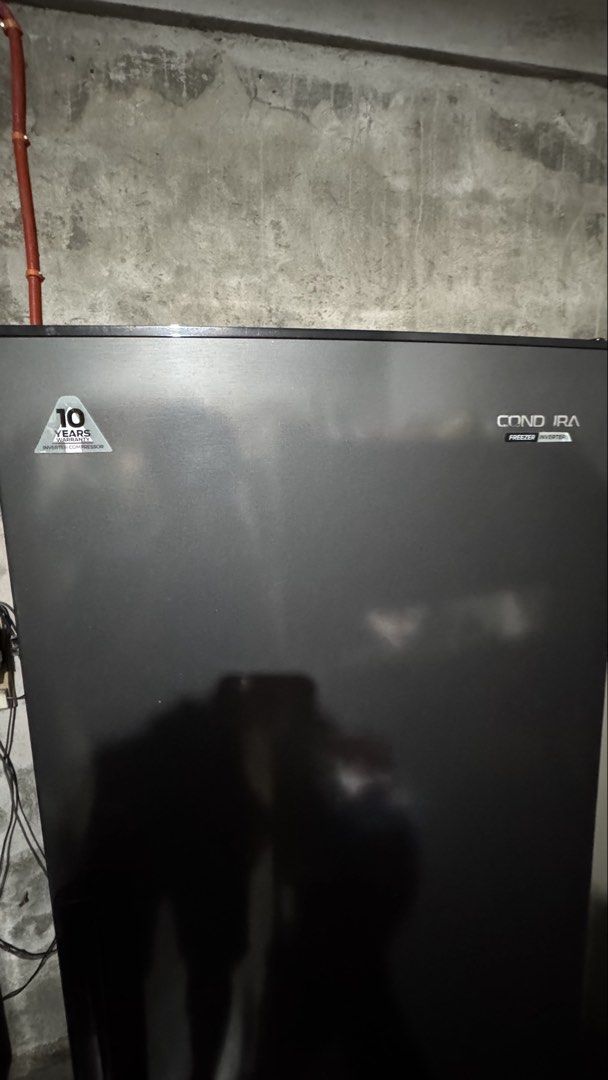 Condura Freezer Inverter Refrigerator (Category: Refrigerators and Freezers) located in Tanza. Submitted by meovvie (Listing ID 1462391468, Image 1). Description: Used only just one year - Condura Inverter Freezer/Refrigerator - Stylish black finish - Keeps food fresh and frozen - 10-year warranty on inverter compressor.