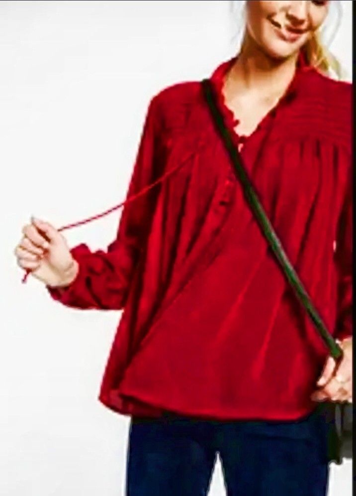 Cortefiel red cherry top XL (Category: Blouses) located in Cabanatuan. Submitted by miss.maia (Listing ID 1462406851, Image 1). Description: The Cortefiel top shown in the image is a long-sleeved, deep red bohemian-style peasant blouse. It features a fractional front button placket with a self-tie tassel or drawstring closure at the neckline, vertical pleated/pintuck shoulder details, and a loose, flowing silhouette..