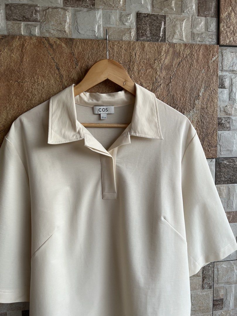 COS - MINIMALIST POLO SHIRT (Category: Others Tops) located in Bacolod City. Submitted by timelessbyjosh (Listing ID 1462399026, Image 2). Description: BEST FOR CASUAL OUTFITS SIZE : LARGE ACTUAL COLOR : OFF WHITE COLOR RATE : 10 OUT OF 10 CONDITION : NEAR NEW MATERIAL : 60 % COTTON , 21 % POLYESTER & 19 % ELASTANE MADE IN : CHINA FLAWS : NONE DIMENSIONS LENGTH - 26 WIDTH - 22 BEST FIT MEDIUM TO LARGE — BOXY FIT MEASUREMENT TAKEN WHILE LAYING FLA