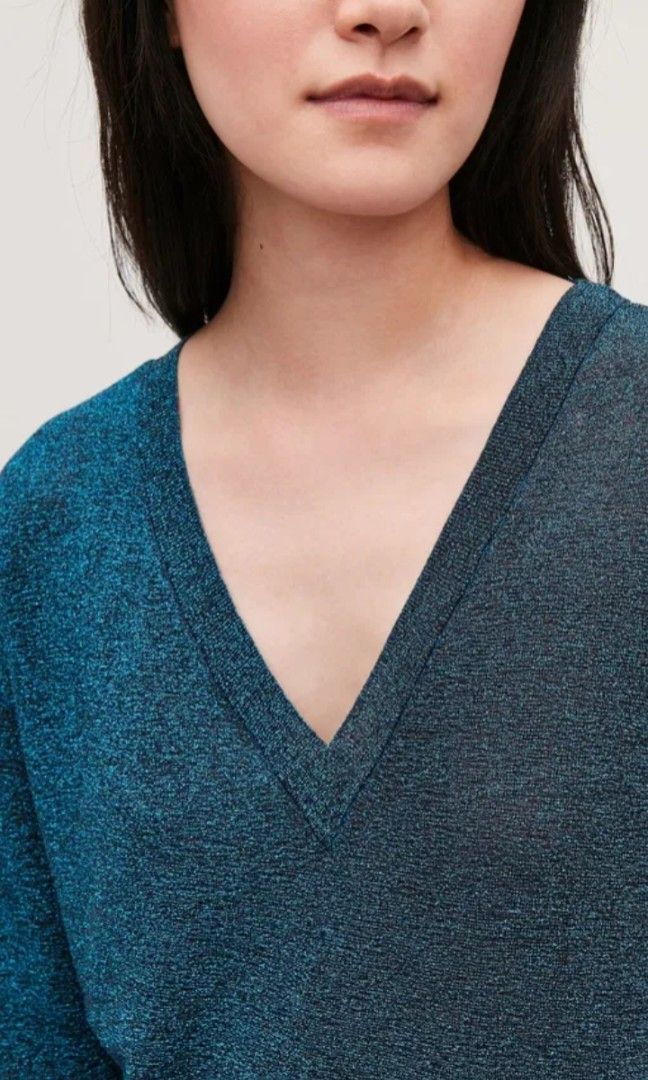 COS Metallic Sheer V-Neck Knit Top (Category: Others Tops) located in Cabanatuan. Submitted by miss.maia (Listing ID 1462428534, Image 3). Description: Product Details Made from a stretchy fine-knit material with a grainy texture and sheer quality, this top is woven with metallic thread for a light-catching quality. A straight, pull-on fit, it has a ribbed V-neck and it is finished with clean edges at the cuffs and hem. 65% Polyester / 35% Metall