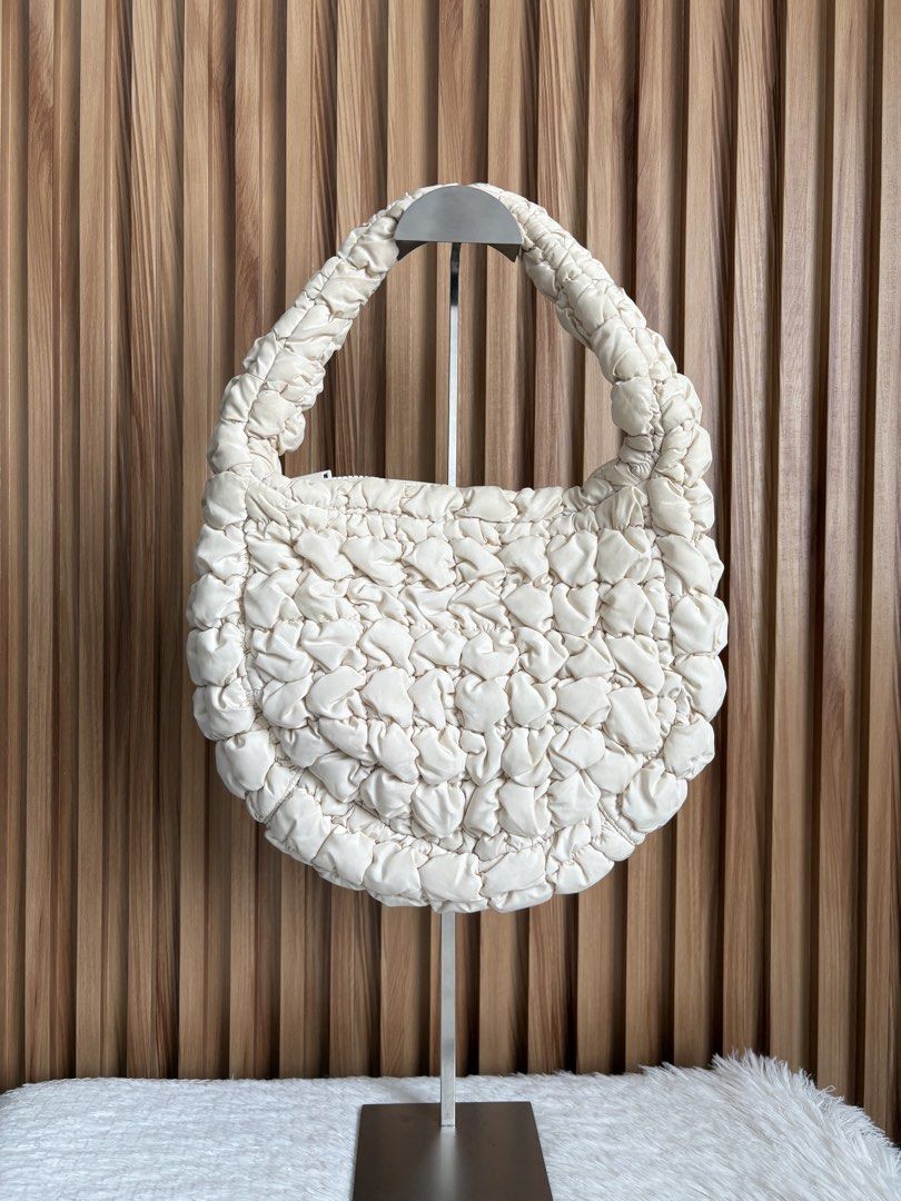 COS QUILTED SMALL BAG IN LIGHT BEIGE (Category: Shoulder Bags) located in Imus. Submitted by dumpitlikeaqueen (Listing ID 1462315212, Image 1). Description: • Bag only • With signs of usage & stain • Open for layaway • Instagram Shop: @dumpitlikeaqueen.