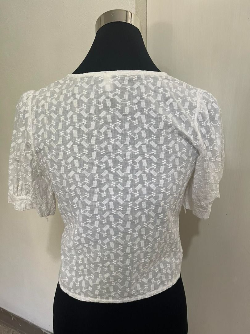 Cottagecore Eyelet Embroidery Square Neck Blouse (Category: Blouses) located in Mabalacat. Submitted by keb-a (Listing ID 1462320819, Image 2). Description: 🍒 — small — b: 32~34" — w: 24~26" — l: 17” 🍒 — eyelet embroidery w/ beautiful, textured floral pattern throughout the fabric — elegant lace detailing framing the neckline and the front button panel — chic, vintage-inspired neckline that highlights the collarbones — functional button-down de