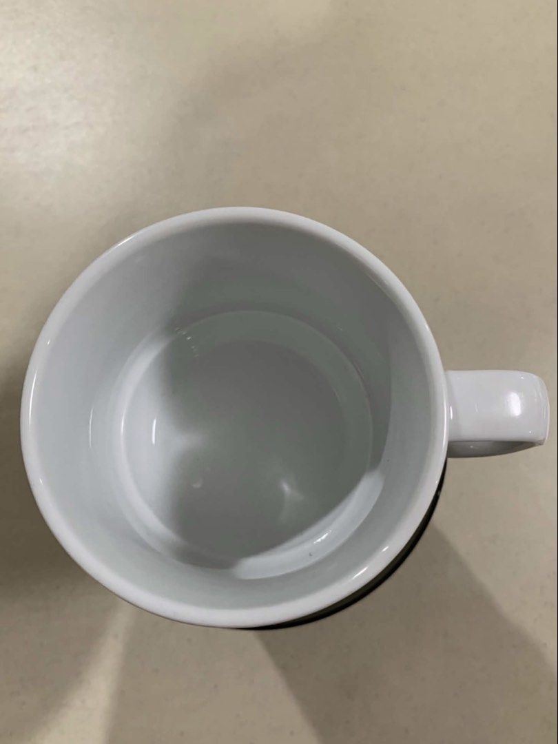 Crate & Barrel Martin Hunt White Ceramic Mug (Category: Coffee & Tea Tableware) located in Quezon City. Submitted by meggoquingco (Listing ID 1462377177, Image 2). Description: - Brand: Crate & Barrel - Designer: Martin Hunt - Material: White Ceramic - Origin: Made in Sri Lanka - Ideal for: Morning coffee or tea - Style: Clean and simple design.