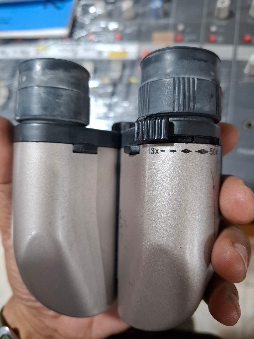 Craton 13-50x27 MC Zoom Binoculars (Category: Lens & Kits) located in Santa Rosa. Submitted by echojapansurplus_01 (Listing ID 1462386696, Image 3). Description: - Craton Zoom Binoculars by Kenko. - Powerful magnification: 13x to 50x - Objective lens diameter: 27mm - Wide field of view: 2.4 degrees at 13x - Ideal for bird watching and outdoor activities - Compact and portable design.