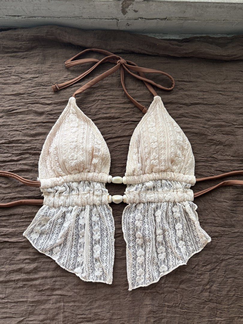 XS Shein Cream Lace Bikini (Category: Bikinis & Swimsuits) located in Muntinlupa City. Submitted by jc444_ (Listing ID 1462413780, Image 1). Description: - used once, bought this for ₱450 on shein app - Cream lace bikini set - Halter neck top with tie-up straps - Beaded detail on the front of the top - Matching bikini bottoms with tie sides - Ideal for beach or pool days - Chic and stylish design.
