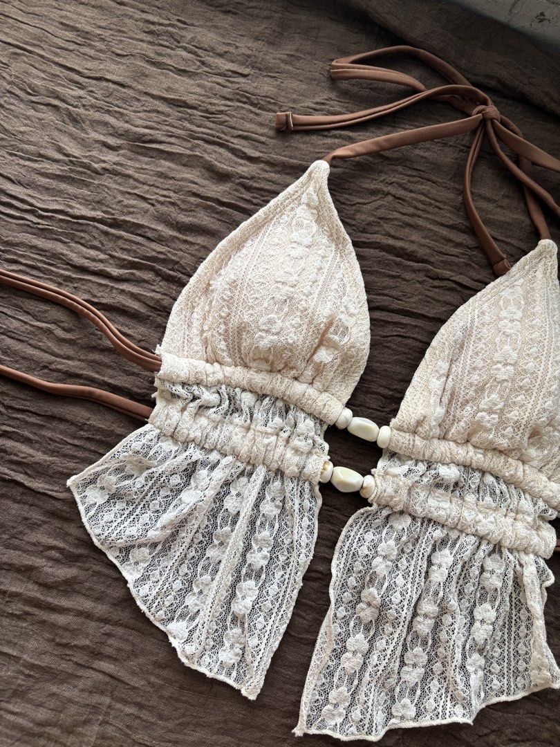 XS Shein Cream Lace Bikini (Category: Bikinis & Swimsuits) located in Muntinlupa City. Submitted by jc444_ (Listing ID 1462413780, Image 2). Description: - used once, bought this for ₱450 on shein app - Cream lace bikini set - Halter neck top with tie-up straps - Beaded detail on the front of the top - Matching bikini bottoms with tie sides - Ideal for beach or pool days - Chic and stylish design.