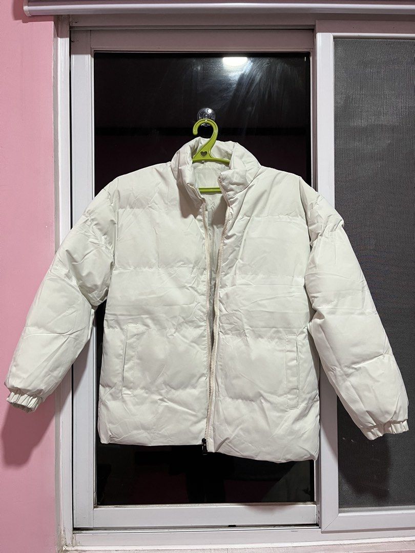 Cream/Off White Puffer Jacket (Category: Coats, Jackets and Outerwear) located in Dasmarinas. Submitted by gmxngmmd (Listing ID 1462432030, Image 1). Description: Cream/Off White Puffer Jacket - Cream/Off White colored puffer jacket - High neck with zip closure - Elasticated cuffs and hem - Fully lined interior - Warm and cozy, ideal for cooler weather Size: Medium Length: 26 inches Chest: 22 inches Shoulder: 20 inches Arm Length: 20 inches Brand
