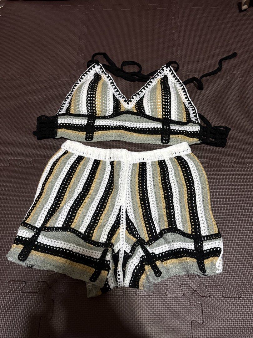 Crochet Bralette and Shorts Set (Category: Sets or Coordinates) located in Manila. Submitted by jennielynr54043 (Listing ID 1462344370, Image 1). Description: - Striped crochet bralette and matching shorts set - Colors: Black, white, grey, and gold stripes - Bralette features adjustable ties at the neck and back - Shorts have a comfortable elastic waistband - Ideal for beach days, festivals, or as a stylish layering piece.