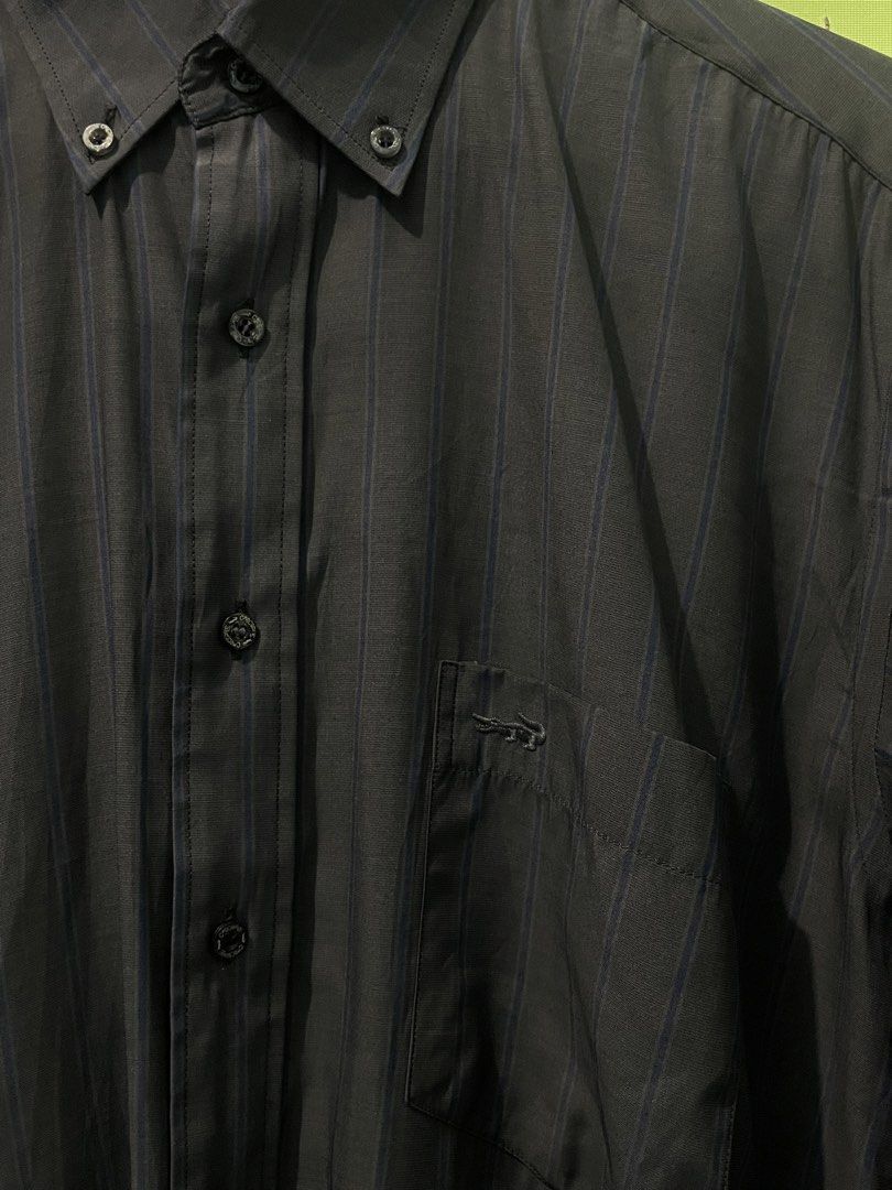 Crocodile Men's Striped Button-Up Shirt (Category: Tshirts & Polo Shirts ) located in Manila. Submitted by oenthrift.2026 (Listing ID 1462433678, Image 3). Description: - Classic Crocodile button-up shirt - Subtle grey and blue vertical pinstripes - Chest pocket with signature Crocodile logo - Button-down collar - Ideal for smart casual occasions - Sharp and stylish look.
