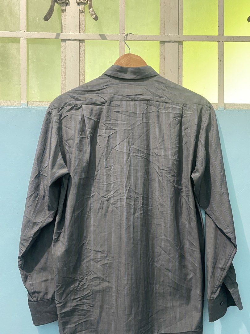 Crocodile Men's Striped Button-Up Shirt (Category: Tshirts & Polo Shirts ) located in Manila. Submitted by oenthrift.2026 (Listing ID 1462433678, Image 2). Description: - Classic Crocodile button-up shirt - Subtle grey and blue vertical pinstripes - Chest pocket with signature Crocodile logo - Button-down collar - Ideal for smart casual occasions - Sharp and stylish look.