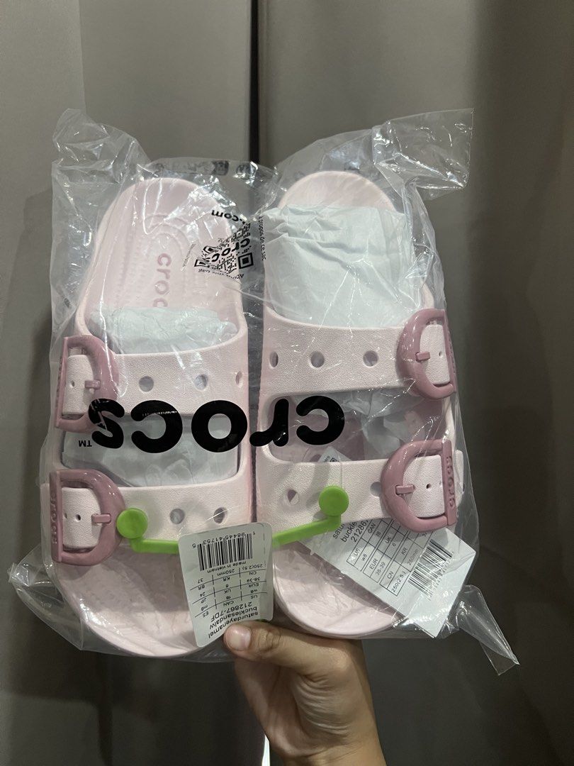 Crocs Classic Crush Clog Pink Sandals (Category: Sandals) located in Baliuag. Submitted by shop.avg (Listing ID 1462314841, Image 2). Description: - Brand new Pink Crocs Classic Crush Clogs - Still in original packaging - Features adjustable straps - Signature Crocs holes - Soft pastel pink color - Ideal for casual wear.