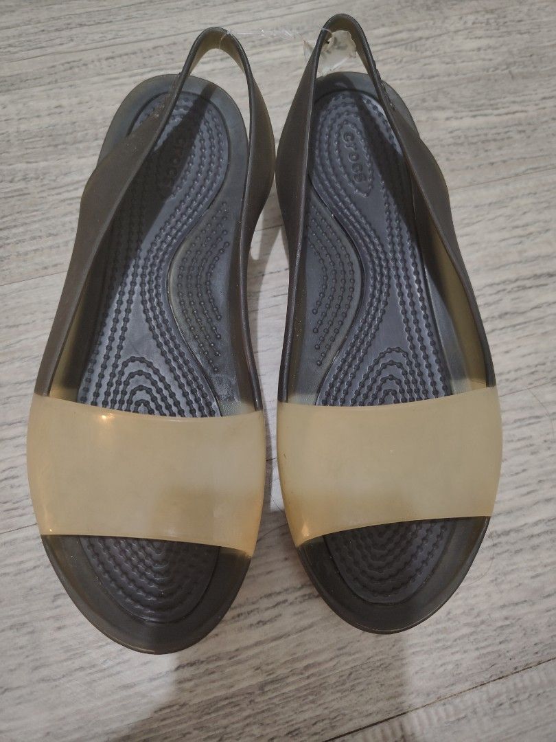 Crocs Women's Slingback Flats US 5 (Category: Flats & Sandals) located in Calamba. Submitted by an_ne0501 (Listing ID 1462402425, Image 1). Description: - Crocs slingback flats - Color: Dark grey/black - Translucent tan toe strap - Comfortable and easy to slip on - Soles with good grip - Size: W5 / EU 34-35 / 22cm insole - Made in China.
