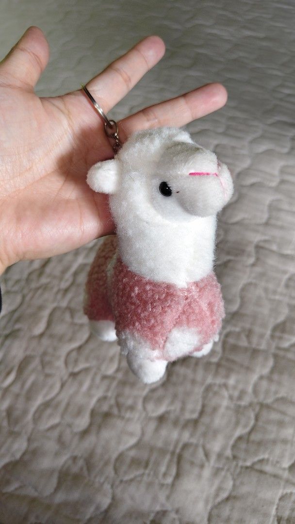 Cute Alpaca Plush Keychain with Pink Sweater (Category: Plushies & Soft Toys) located in Baguio. Submitted by je_ver_lyn16 (Listing ID 1462333452, Image 1). Description: - Adorable alpaca plush keychain - Features a cute pink fuzzy sweater - Soft and cuddly material - Perfect accessory for bags or keys - Ideal for anyone who loves cute things - from ht box.