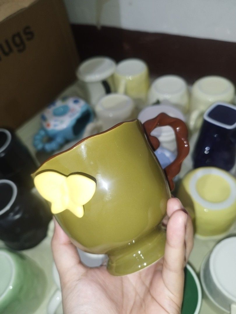Cute Ceramic Mugs (Category: Coffee & Tea Tableware) located in Manila. Submitted by rslynsnchz51648 (Listing ID 1462353329, Image 3). Description: - Unique ceramic mugs available - Designs include: Festive Santa, Cool Wrench-Handle, Charming Butterfly, 'Good Luck' - Ideal for coffee, tea, or hot chocolate - Great as gifts or for personal use - Add a fun touch to your kitchen.