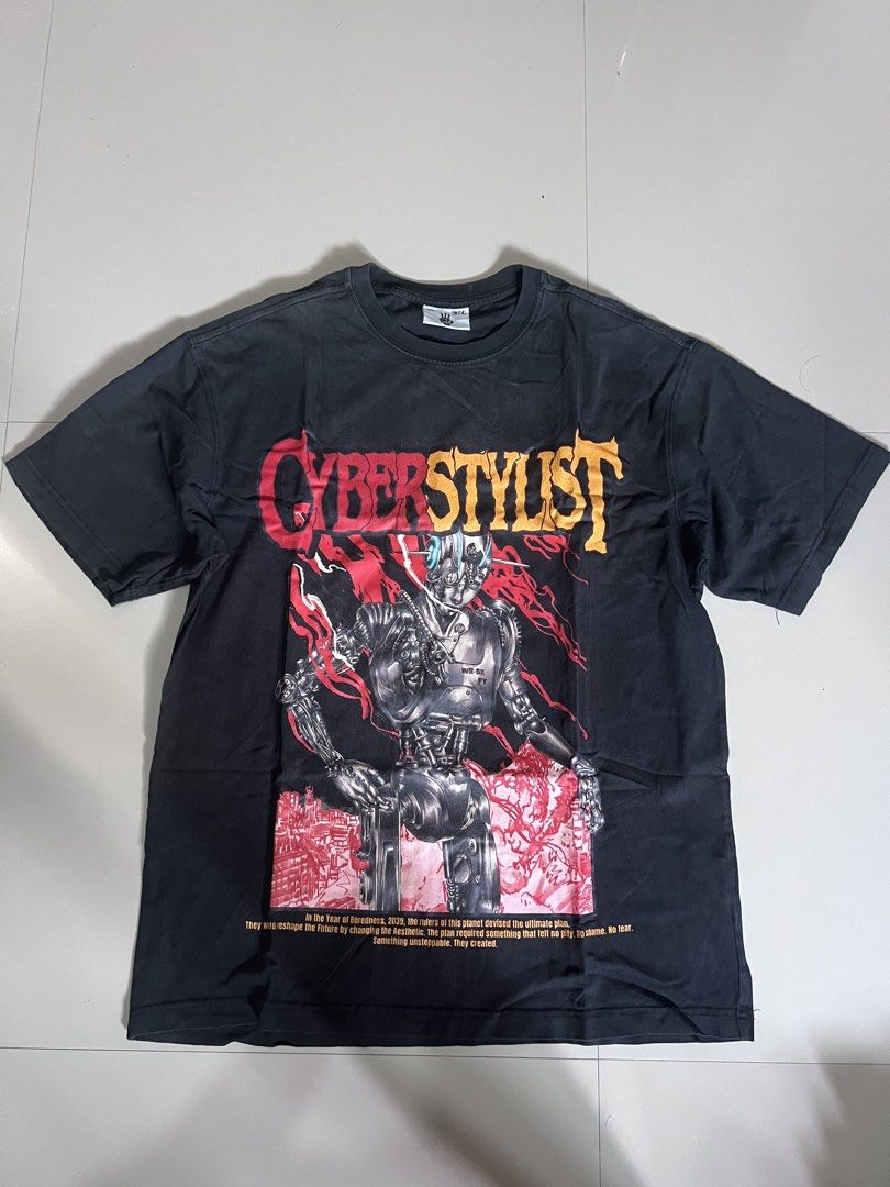 Cyberstylist Graphic T-Shirt (Category: Tshirts & Polo Shirts ) located in Caloocan City. Submitted by vintage2333 (Listing ID 1462376823, Image 1). Description: - Black t-shirt with unique Cyberstylist graphic - Features a robot design and '2039' text - Ideal for cyberpunk and futuristic enthusiasts - Made from comfortable fabric for casual wear.