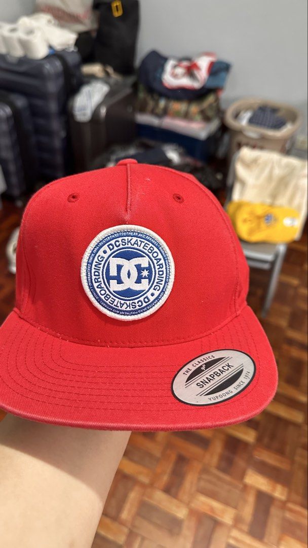 DC Shoes Snapback Cap Red (Category: Caps & Hats) located in Manila. Submitted by dyelizabet65197 (Listing ID 1462278649, Image 2). Description: - Classic red DC Shoes snapback cap - Features iconic DC logo patch on the front - "Yupoong The Classics" tag visible - Adjustable snapback closure for a custom fit - Ideal for everyday casual wear.