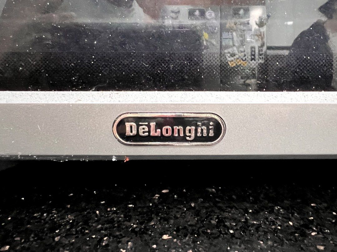 Delonghi Sfotnatutto Oven (Category: Ovens & Toasters) located in Quezon City. Submitted by brightdragon.0c2ee7 (Listing ID 1462437660, Image 3). Description: > 3 months used only for baking sourdough and cookies > Perfect for homebakers > Make breads, roast meats, cakes, etc. > Box included > Rotisserie screw included > 2 wired baking trays included > Bought only last Feb 2026 Note: > Little scratches can be found by the over door handle > Tiny 