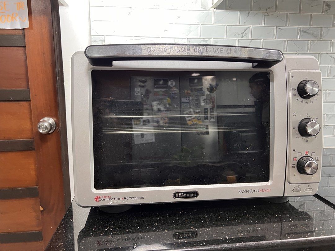 Delonghi Sfotnatutto Oven (Category: Ovens & Toasters) located in Quezon City. Submitted by brightdragon.0c2ee7 (Listing ID 1462437660, Image 2). Description: > 3 months used only for baking sourdough and cookies > Perfect for homebakers > Make breads, roast meats, cakes, etc. > Box included > Rotisserie screw included > 2 wired baking trays included > Bought only last Feb 2026 Note: > Little scratches can be found by the over door handle > Tiny 
