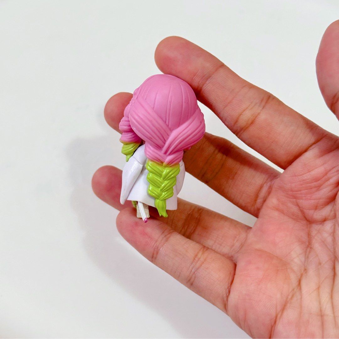 Demon Slayer “Mitsuri Kanroji” Mini Figure (Category: Figurines & Statues) located in Manila. Submitted by ashyyel_ (Listing ID 1462432159, Image 2). Description: no standee - no markings.