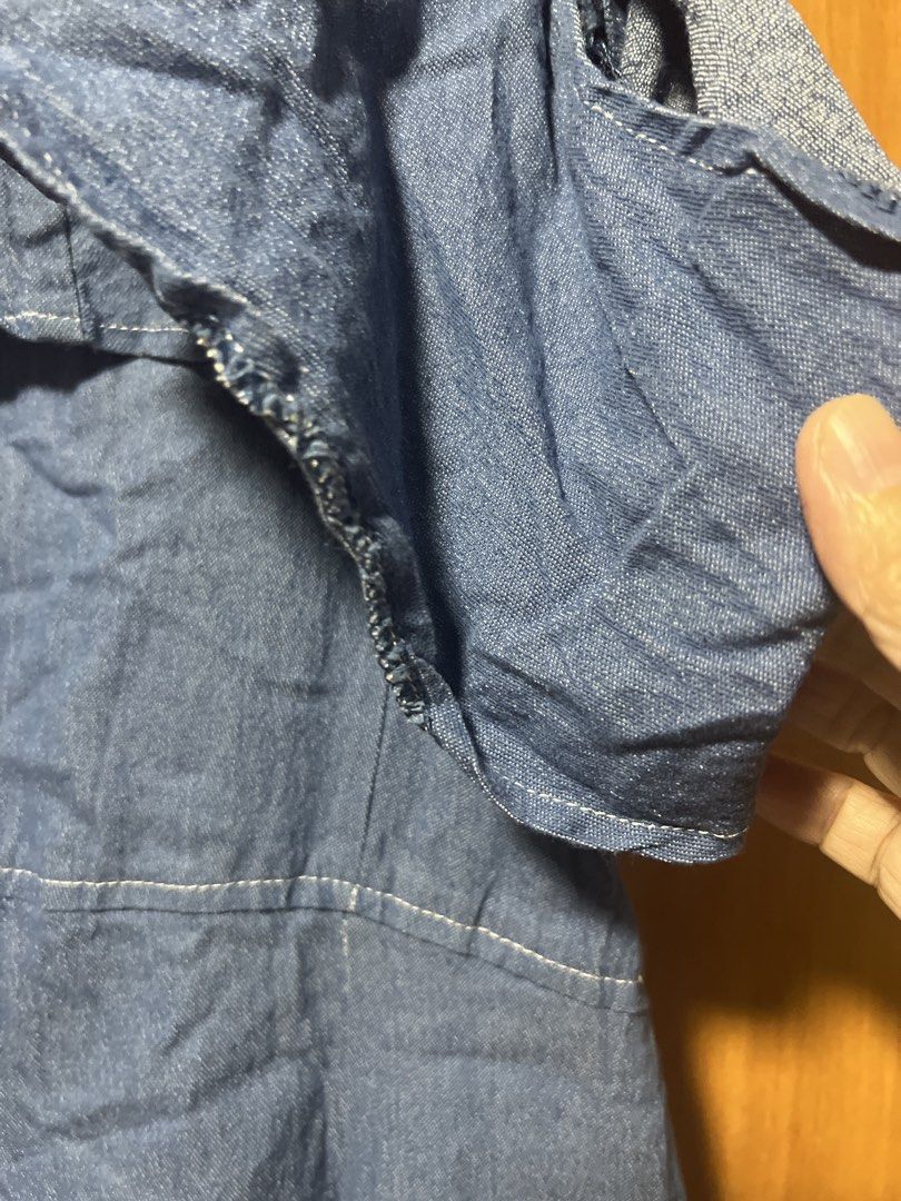 Denim Ruffle Cold Shoulder Jumpsuit (Category: Jumpsuits) located in Pasig City. Submitted by zebteashoppe01 (Listing ID 1462403957, Image 3). Description: - Blue denim jumpsuit - Ruffle detail across shoulders - Short sleeves - Tie waist for a flattering fit - Button-up front - Cropped wide leg silhouette - Functional pockets - Ideal for casual outings Small to medium 09096535540 Jnt Pasig .