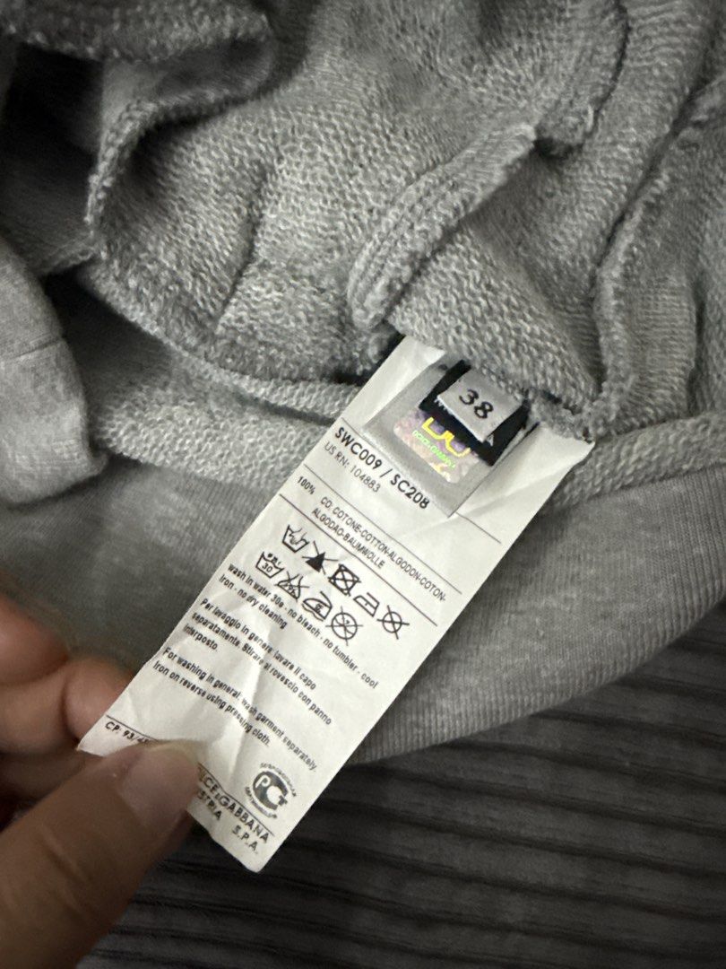 D&G Grey Sweatshirt (Category: Family Planning) located in Angeles City. Submitted by migs_font29 (Listing ID 1462390275, Image 3). Description: - Grey D&G sweatshirt - Embroidered D&G logo on front - Drawstring detail at neckline - Raglan sleeves with white piping - 100% Cotton.