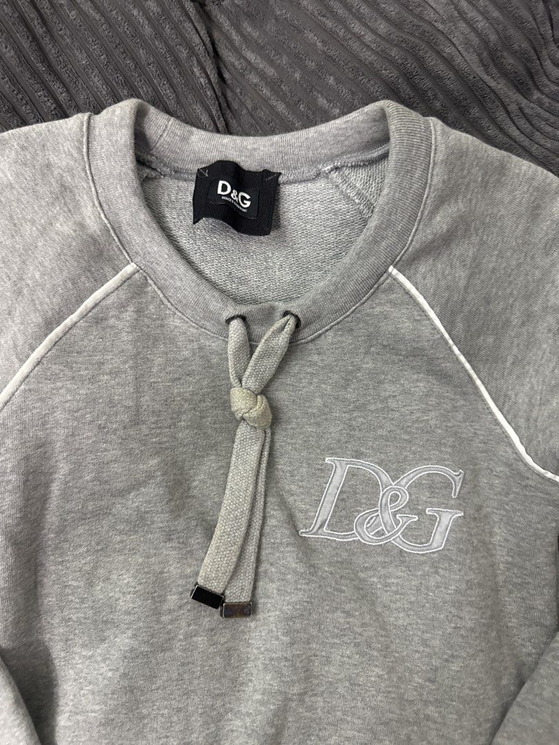 D&G Grey Sweatshirt (Category: Family Planning) located in Angeles City. Submitted by migs_font29 (Listing ID 1462390275, Image 2). Description: - Grey D&G sweatshirt - Embroidered D&G logo on front - Drawstring detail at neckline - Raglan sleeves with white piping - 100% Cotton.